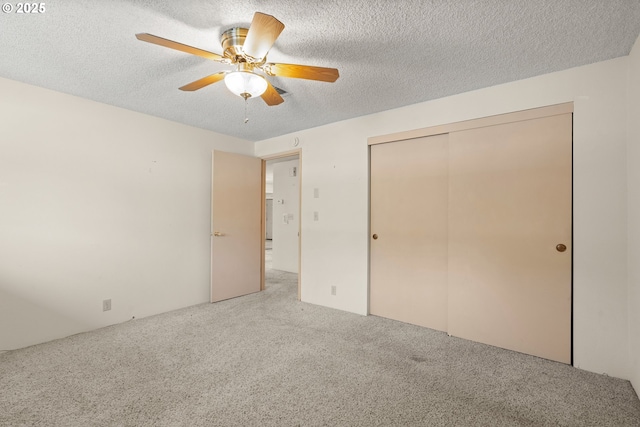 713 Brookside Cir, Rogue River, OR 97537 - unfurnished bedroom featuring carpet flooring, a textured ceiling, a closet, and ceiling fan