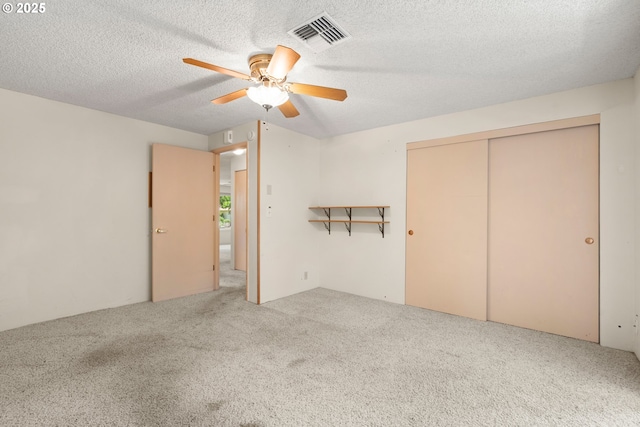 713 Brookside Cir, Rogue River, OR 97537 - unfurnished bedroom featuring carpet, a closet, a textured ceiling, and ceiling fan