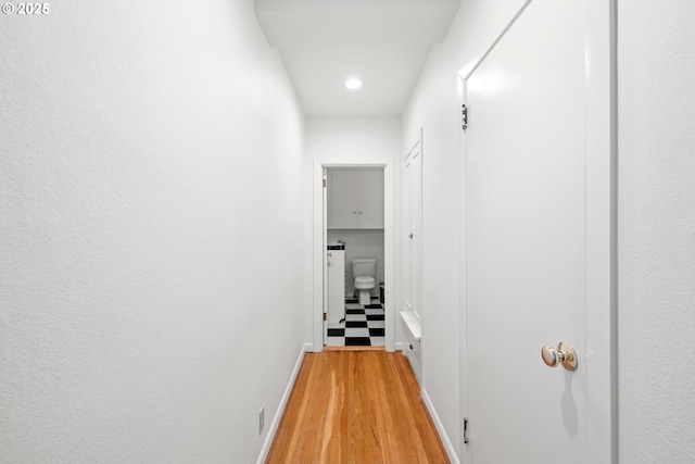 hall with light hardwood / wood-style flooring