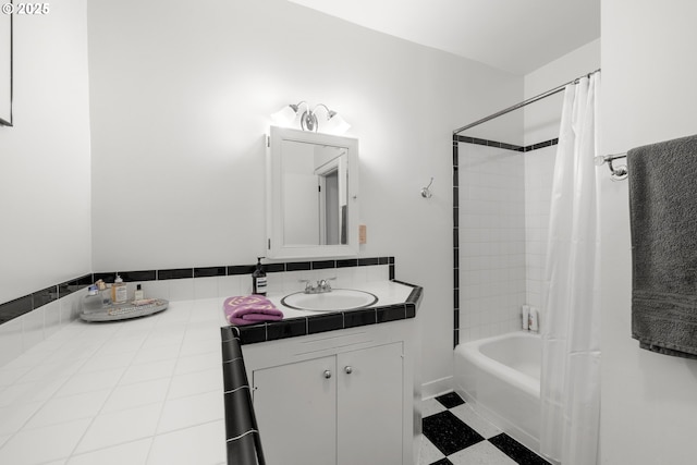 bathroom featuring vanity and shower / tub combo