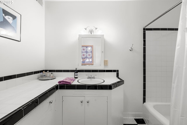 bathroom featuring vanity and shower / bath combination with curtain