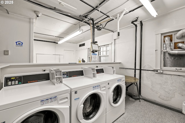 washroom with washing machine and dryer