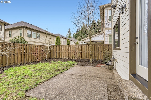 view of yard featuring a patio and a fenced backyard