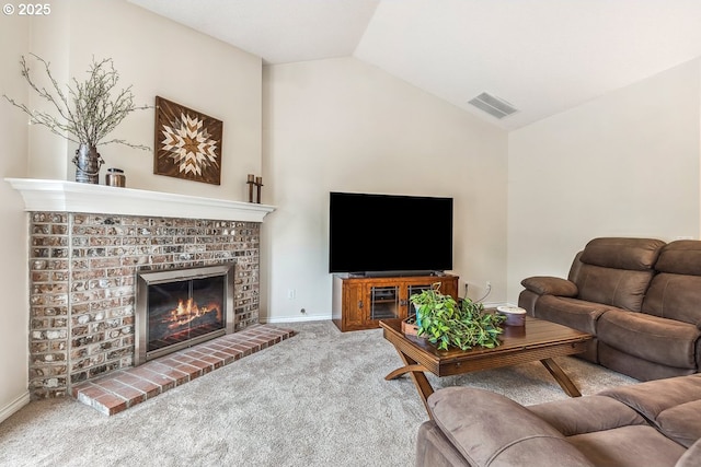 living room featuring carpet floors, visible vents, lofted ceiling, and a fireplace