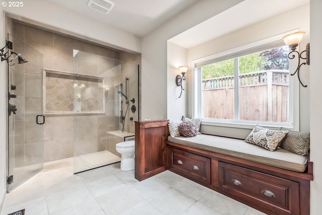 full bath featuring visible vents, tile patterned floors, toilet, and a shower stall