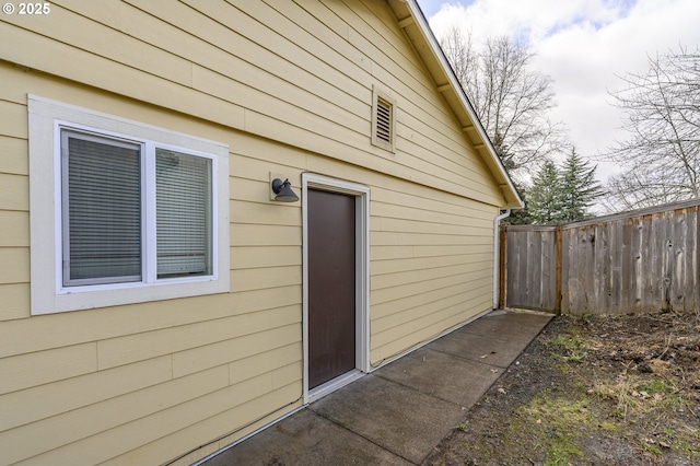 view of side of home with fence