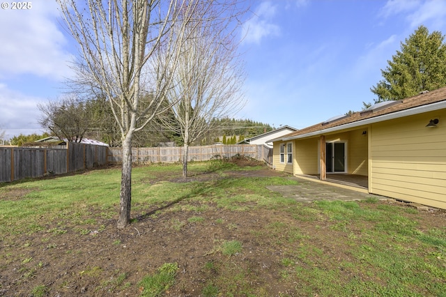 view of yard featuring a patio and a fenced backyard