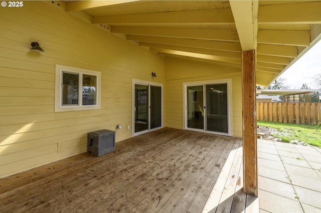 view of patio / terrace featuring a wooden deck and fence