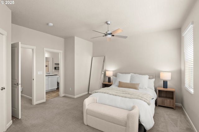 11469 SW Mont Blanc St, Wilsonville, OR 97070 - bedroom featuring light colored carpet, ensuite bath, and a ceiling fan