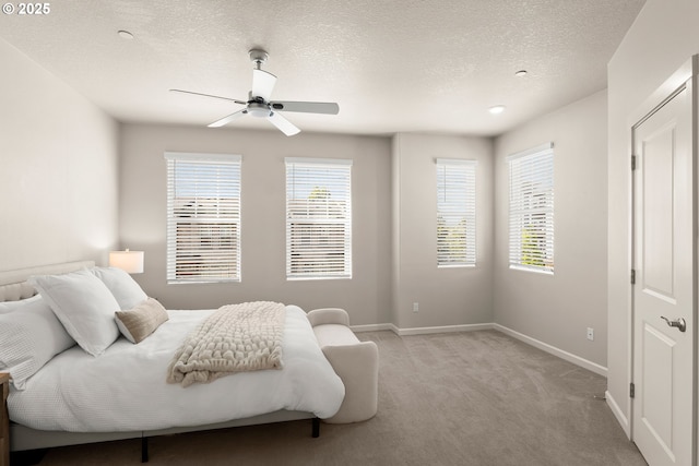 11469 SW Mont Blanc St, Wilsonville, OR 97070 - bedroom with light colored carpet, a textured ceiling, and a ceiling fan