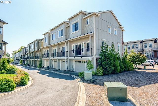 11469 SW Mont Blanc St, Wilsonville, OR 97070 - view of building exterior featuring a garage and a residential view
