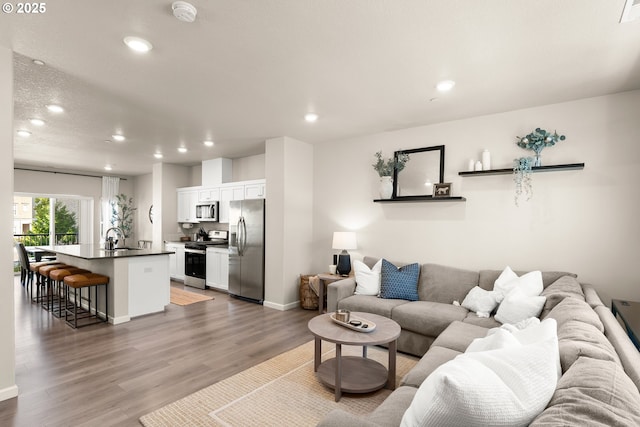 11469 SW Mont Blanc St, Wilsonville, OR 97070 - living room with recessed lighting and light wood finished floors