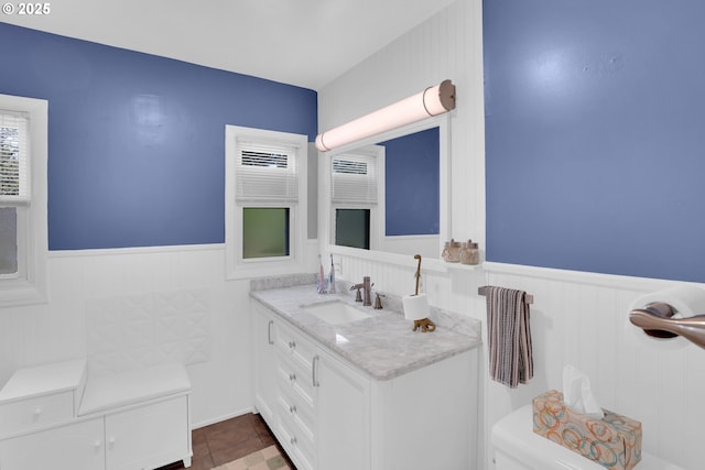 8011 SE Lambert St, Portland, OR 97206 - half bathroom featuring vanity, wainscoting, and toilet