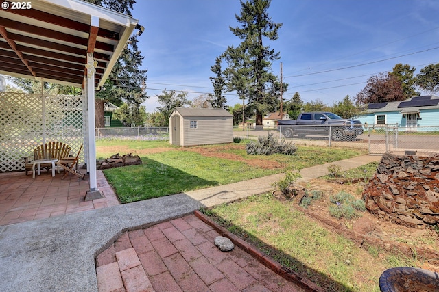 8011 SE Lambert St, Portland, OR 97206 - view of yard featuring a fenced backyard, a storage unit, a patio, and an outdoor structure