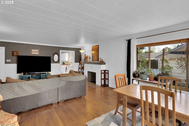 8011 SE Lambert St, Portland, OR 97206 - dining space with a fireplace and wood finished floors