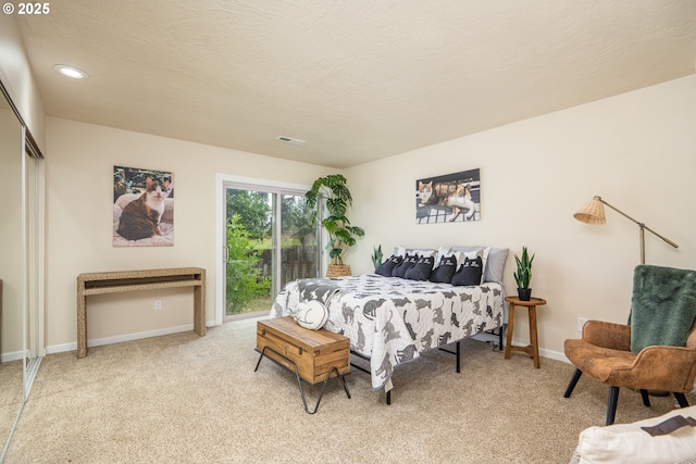1193 Cedar Pl, Creswell, OR 97426 - bedroom featuring light carpet, access to outside, a textured ceiling, a closet, and recessed lighting
