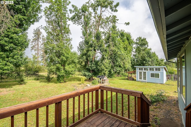 1193 Cedar Pl, Creswell, OR 97426 - wooden deck featuring an outdoor structure and a fenced backyard