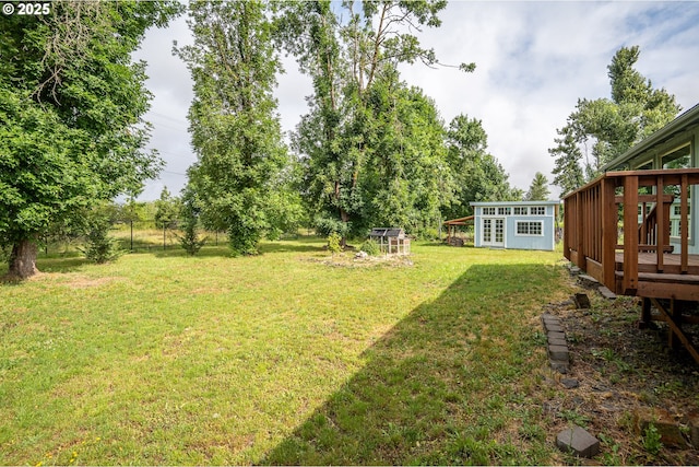 1193 Cedar Pl, Creswell, OR 97426 - view of yard with a wooden deck and an outdoor structure