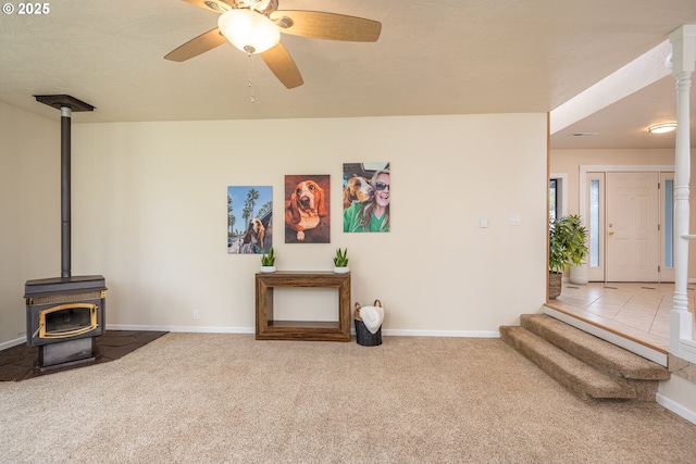 1193 Cedar Pl, Creswell, OR 97426 - unfurnished living room with a wood stove, carpet flooring, and ceiling fan