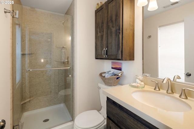 1190 Hazelnut Ct, Creswell, OR 97426 - bathroom featuring a stall shower, toilet, and vanity