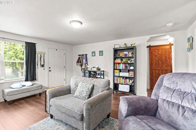 1483 5th St, Springfield, OR 97477 - living room with a barn door and wood finished floors