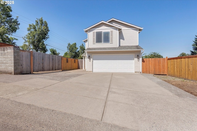 traditional-style house with concrete driveway and a garage