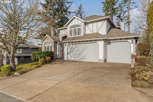 tudor house featuring a garage