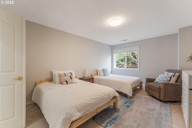 bedroom with light carpet