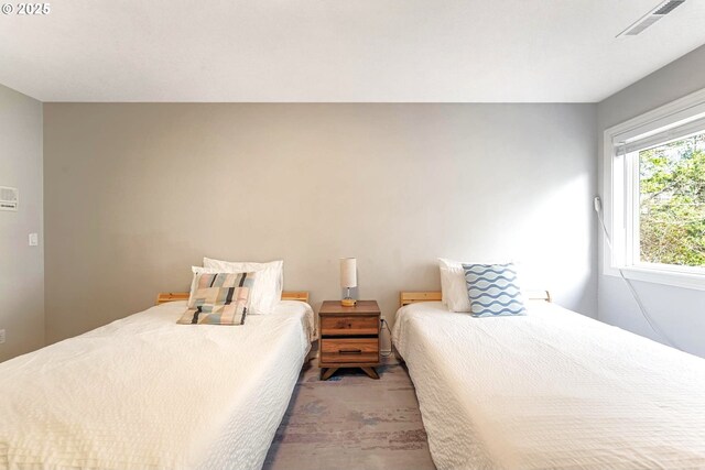 bedroom with light colored carpet