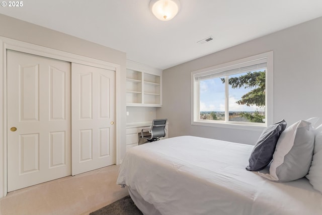 carpeted bedroom featuring a closet