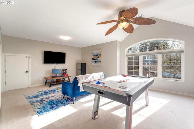 rec room featuring light carpet, vaulted ceiling, and ceiling fan