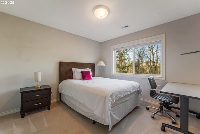 bedroom featuring light colored carpet