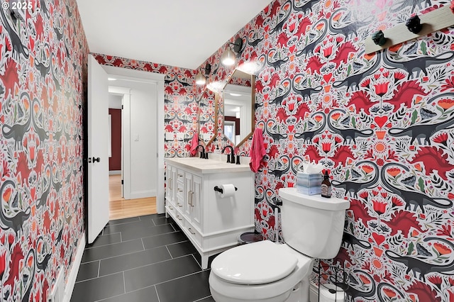 bathroom featuring tile patterned floors, toilet, and vanity