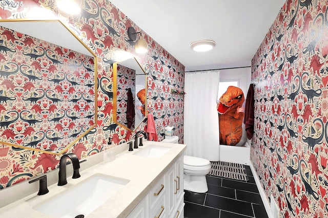 full bathroom featuring toilet, vanity, shower / tub combo, and tile patterned floors