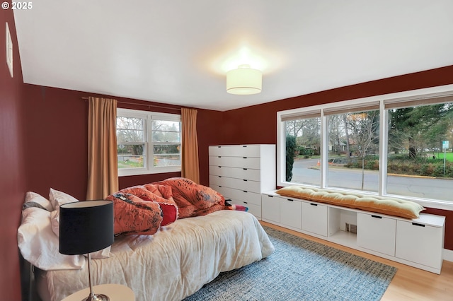 bedroom with light hardwood / wood-style floors