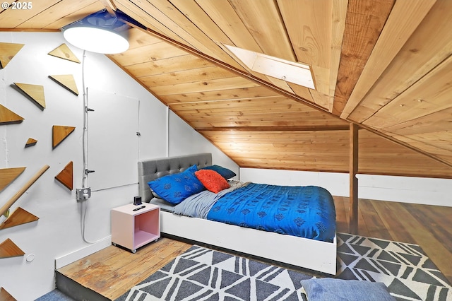 bedroom featuring hardwood / wood-style flooring, wooden ceiling, and vaulted ceiling with skylight