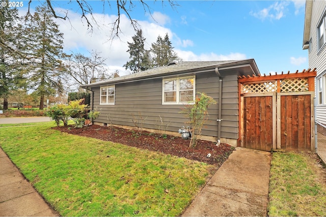 view of home's exterior with a lawn