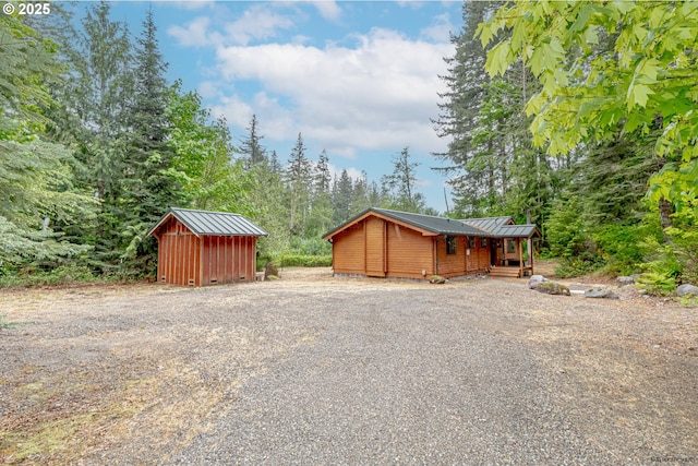 22190 E Lolo Pass Rd, Rhododendron, OR 97049 - view of home's exterior featuring driveway, covered porch, and metal roof