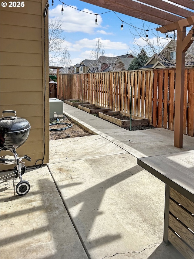 view of patio with a fenced backyard and a grill