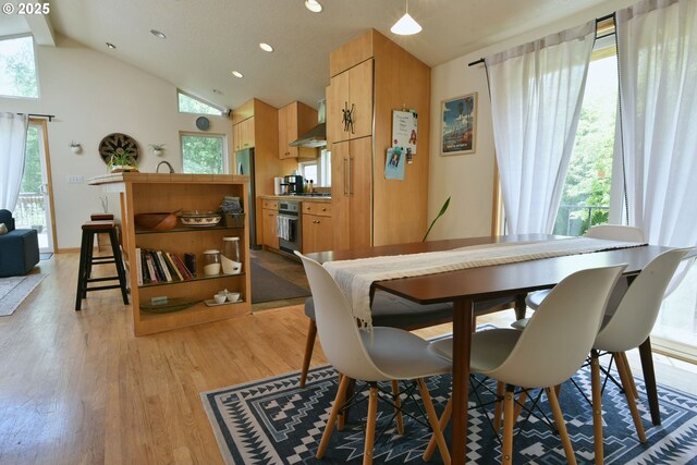 8302 SW 65th Ave, Portland, OR 97219 - dining room featuring vaulted ceiling, light wood finished floors, and recessed lighting