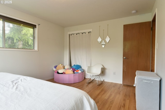8302 SW 65th Ave, Portland, OR 97219 - bedroom featuring light wood-style flooring and baseboards