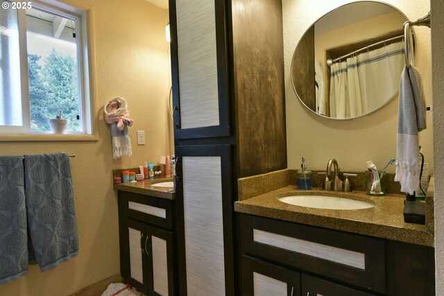 8302 SW 65th Ave, Portland, OR 97219 - full bathroom with vanity and a textured wall