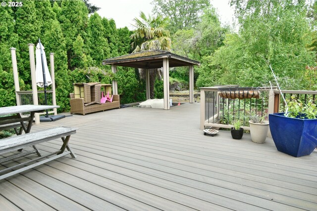 8302 SW 65th Ave, Portland, OR 97219 - wooden terrace featuring a gazebo and outdoor dining space