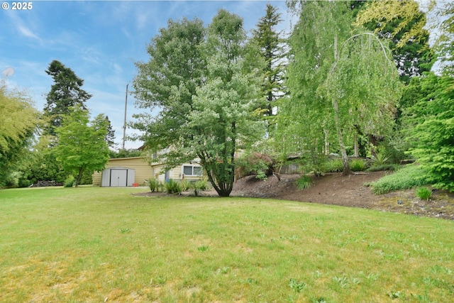 8302 SW 65th Ave, Portland, OR 97219 - view of grassy yard with a shed and an outbuilding