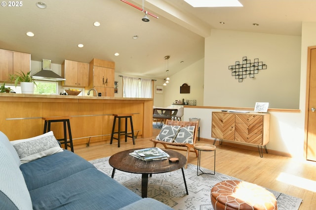 8302 SW 65th Ave, Portland, OR 97219 - living area with light wood-type flooring, a skylight, baseboards, and recessed lighting