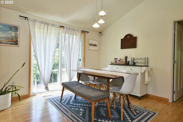 8302 SW 65th Ave, Portland, OR 97219 - dining space featuring light wood-type flooring, baseboards, and lofted ceiling