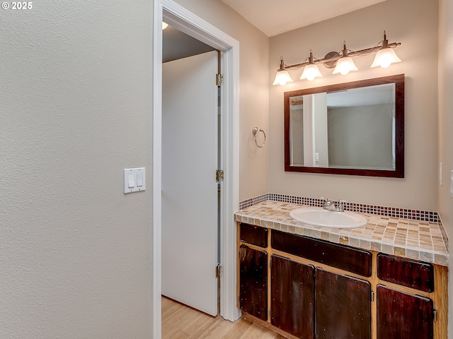 5367 NW 180th Pl, Portland, OR 97229 - bathroom with wood finished floors and vanity