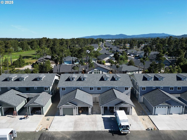 1577 37th St, Florence, OR 97439 - aerial view of residential area featuring mountains