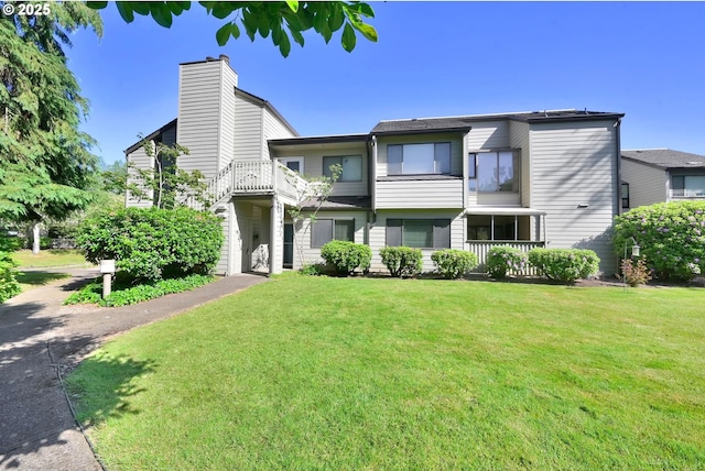 2062 Lake Isle Dr, Eugene, OR 97401 - view of front of house with a front yard and a chimney