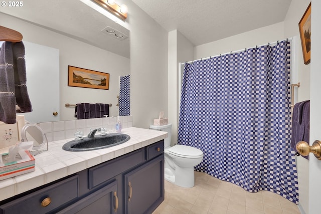 2062 Lake Isle Dr, Eugene, OR 97401 - full bath featuring vanity, toilet, tile patterned floors, and a shower with curtain